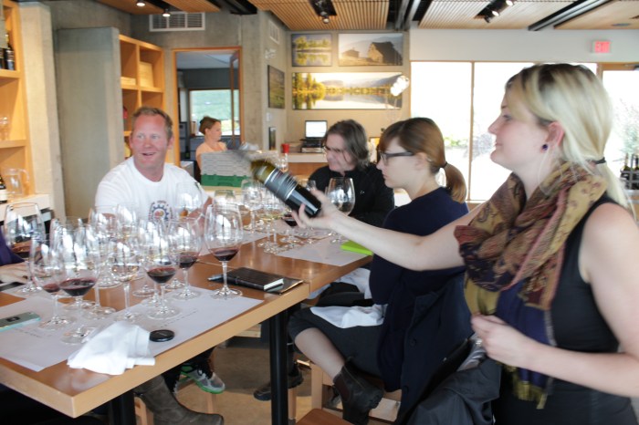 At Black Hills Estate Winery, a dedicated 'wine evangelist' pours a bottle of 2011 Nota Bene, a Bordeaux-style red wine. 