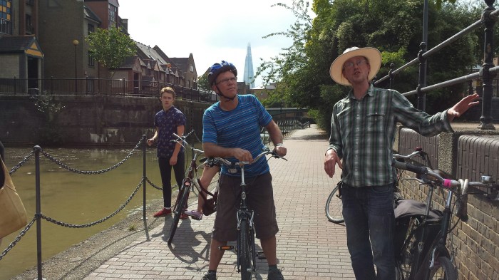 Mathew Tregaron (right) of Cycle Tours of London stops for a breather at deserted Tobacco Dock.